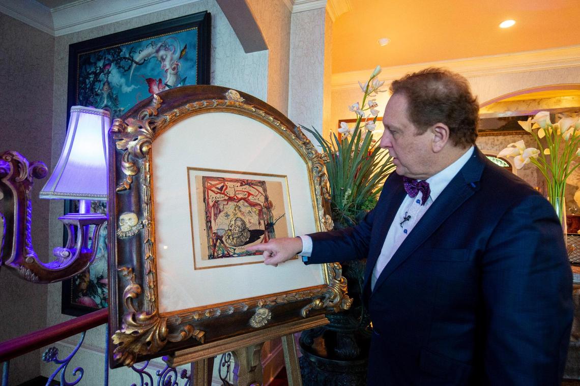 Dr. Christopher Heath Brown shows a drawing by Salvador Dalí of the painting “Cartel de Don Juan Tenorio,” which was stolen from the Venus Over Manhattan gallery in New York City, then mailed back to the gallery from Greece a week later in 2012.
