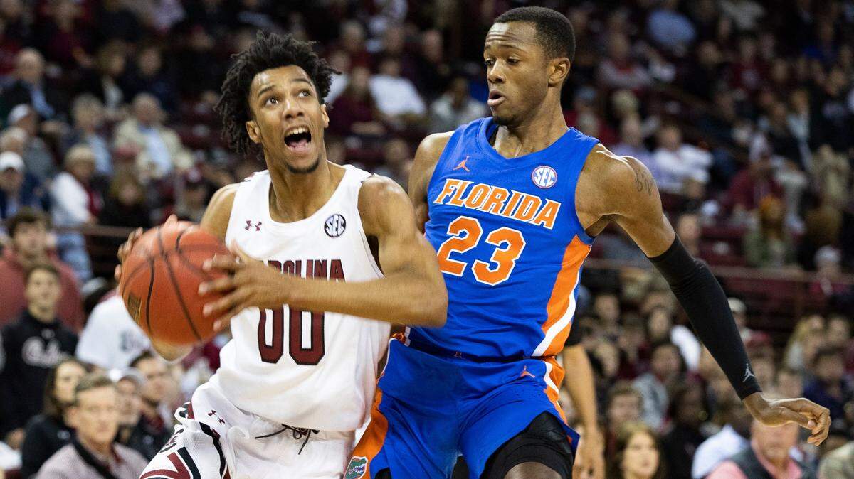 Florida’s Scottie Lewis, right, guards South Carolina’s A.J. Lawson in January 2020. Lewis was drafted by the Charlotte Hornets in the second round early Friday morning.