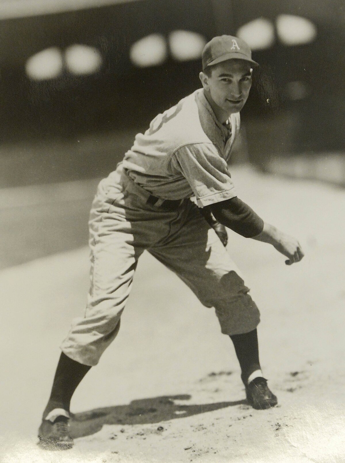 Pitcher Fred Caligiuri, now 99, poses in his Philadelphia Athletics uniform in the early 1940s.