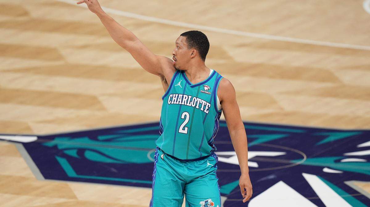 Feb 10, 2024; Charlotte, North Carolina, USA; Charlotte Hornets guard Grant Williams (2) after a 3-point shot during the second quarter against the Memphis Grizzlies at Spectrum Center.