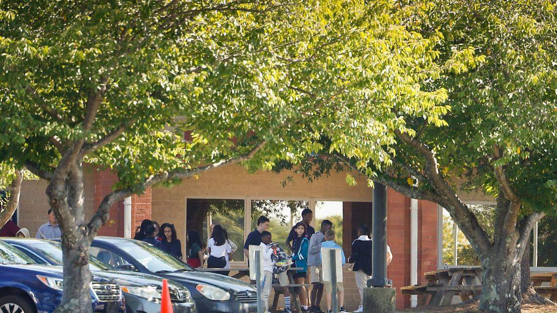 Students gather outside of Kennedy Middle School in Charlotte Wednesday. Olympic High, Kennedy Middle and Steele Creek Elementary were placed on lockdown following a bomb threat on Wednesday.