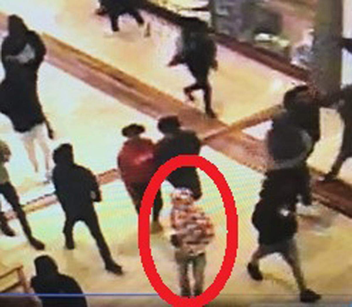 Concord police said the suspect in the Concord Mills shooting is seen here in a security video in a red-and-white checkered hoodie.