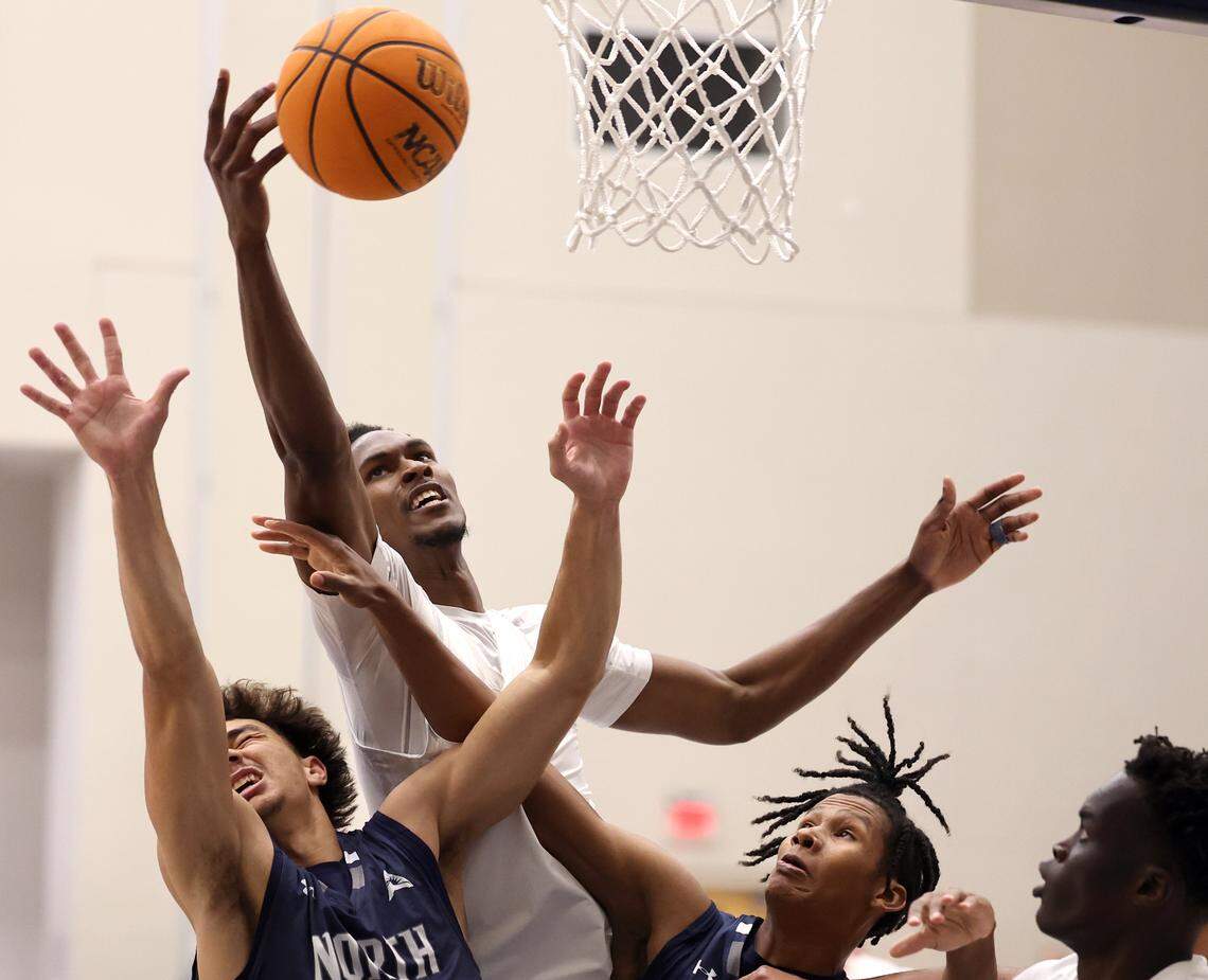 Queens University of Charlotte center Malcolm Wilson towers over his opponents Thursday. Wilson, among the NCAA leaders in blocks this season, had five on Thursday against North Florida.