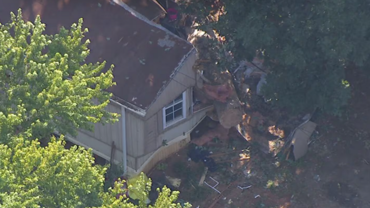 A tree hit a Huntersville home around 3 p.m. Tuesday in the 9500 block of Rollingwood Drive, rescuers say.
