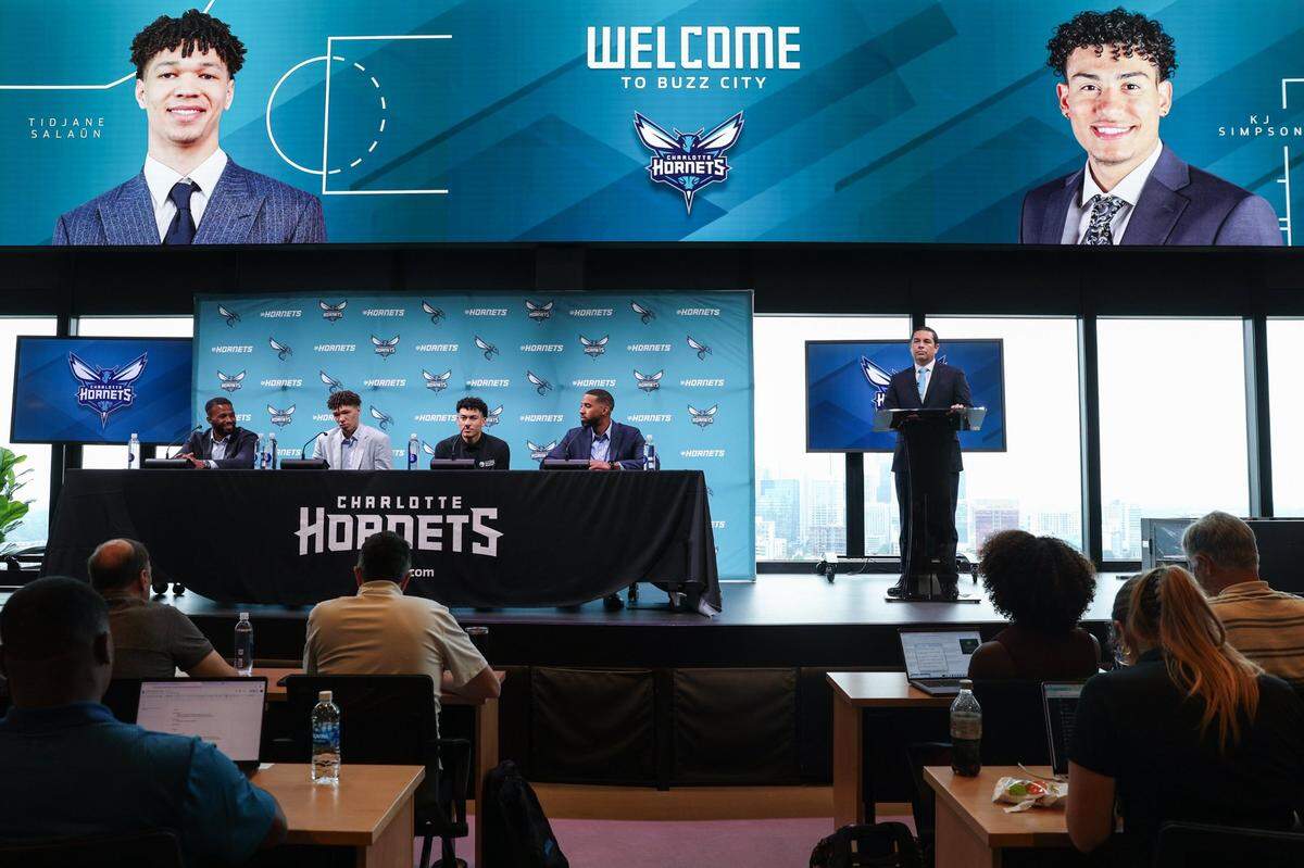The Hornets’ 2024 NBA Draft picks, Tidjane Salaün and KJ Simpson, are introduced during a press conference at Lowe’s Tech Hub in Charlotte on Friday, June 28, 2024.