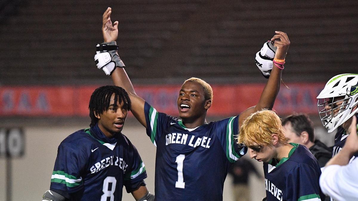 Green Level’s Jackson Spells (1) celebrates with Josh Smith (8) and reacts to their 11-10 overtime victory over Lake Norman in the NCHSAA 4A Lacrosse Boys Championship.Green Level and Lake Norman met in the NCHSAA 4A Boys Lacrosse Final at Durham County Stadium on May 17, 2024.