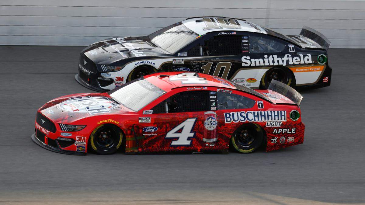 Kevin Harvick (4) races Aric Almirola (10) during the NASCAR Cup Series auto race at Michigan International Speedway in Brooklyn, Mich., Sunday, Aug. 9, 2020. (AP Photo/Paul Sancya)