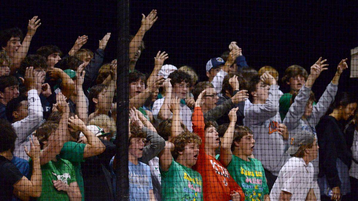 Myers Park Mustangs fans cheer on their team as they battle the Ardrey Kell Knights on Thursday, May 12, 2022. The Mustangs defeated the Knights 8-6 in NCHSAA second round baseball playoff action.