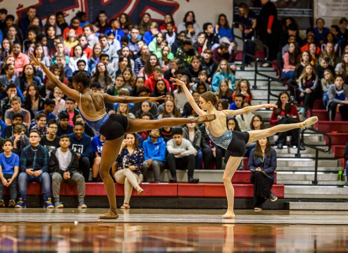 Victoria Jaenson and fellow Charlotte Ballet II dancer Macyn Vogt perform matching first arabesques.