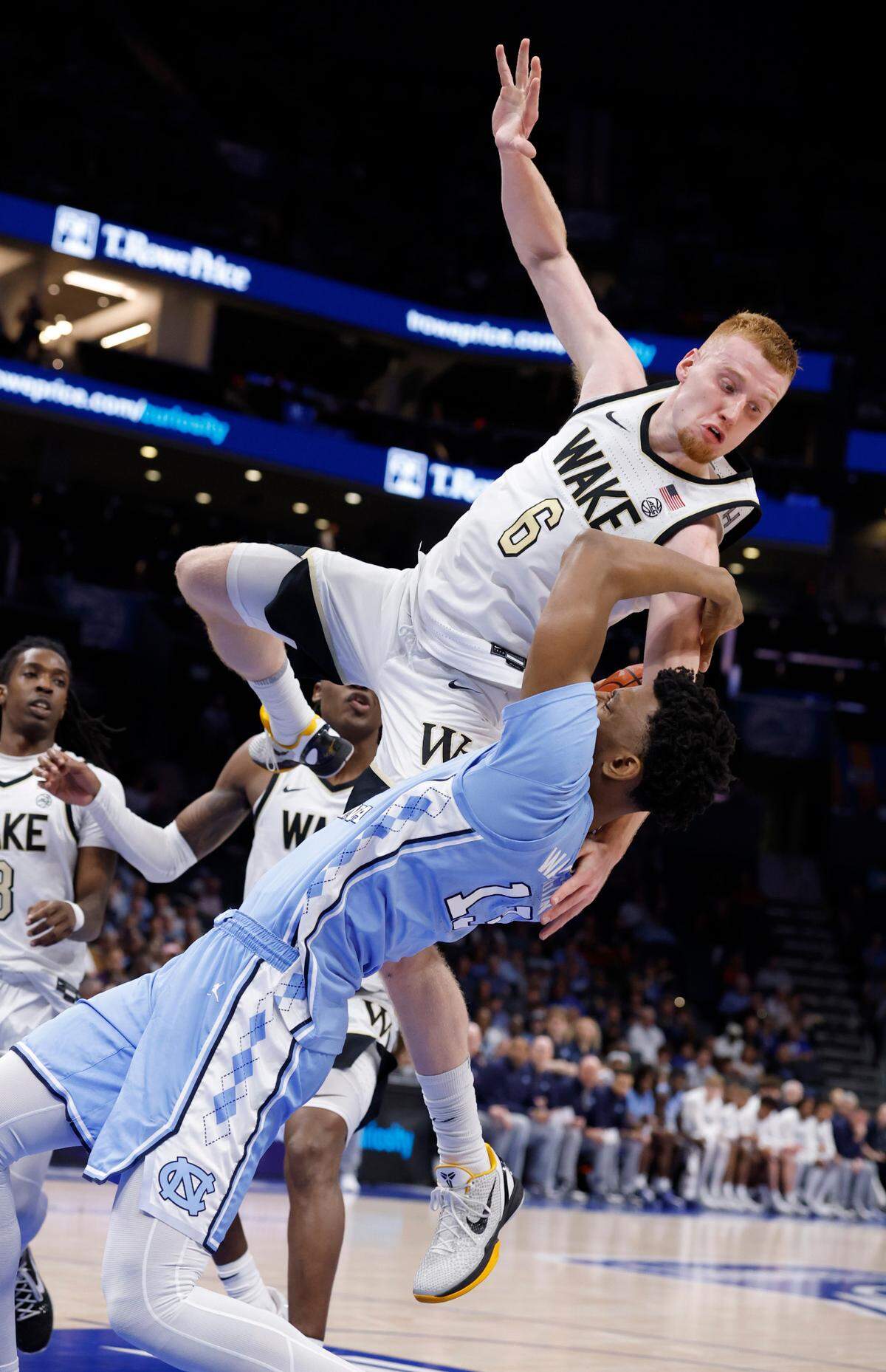 Wake Forest’s Cameron Hildreth (6) fouls North Carolina’s Jalen Washington (13) during the first half of UNC’s game against Wake Forest in the quarterfinals of the 2025 ACC Men’s Basketball Tournament at the Spectrum Center in Charlotte, N.C., Thursday, March 13, 2025.