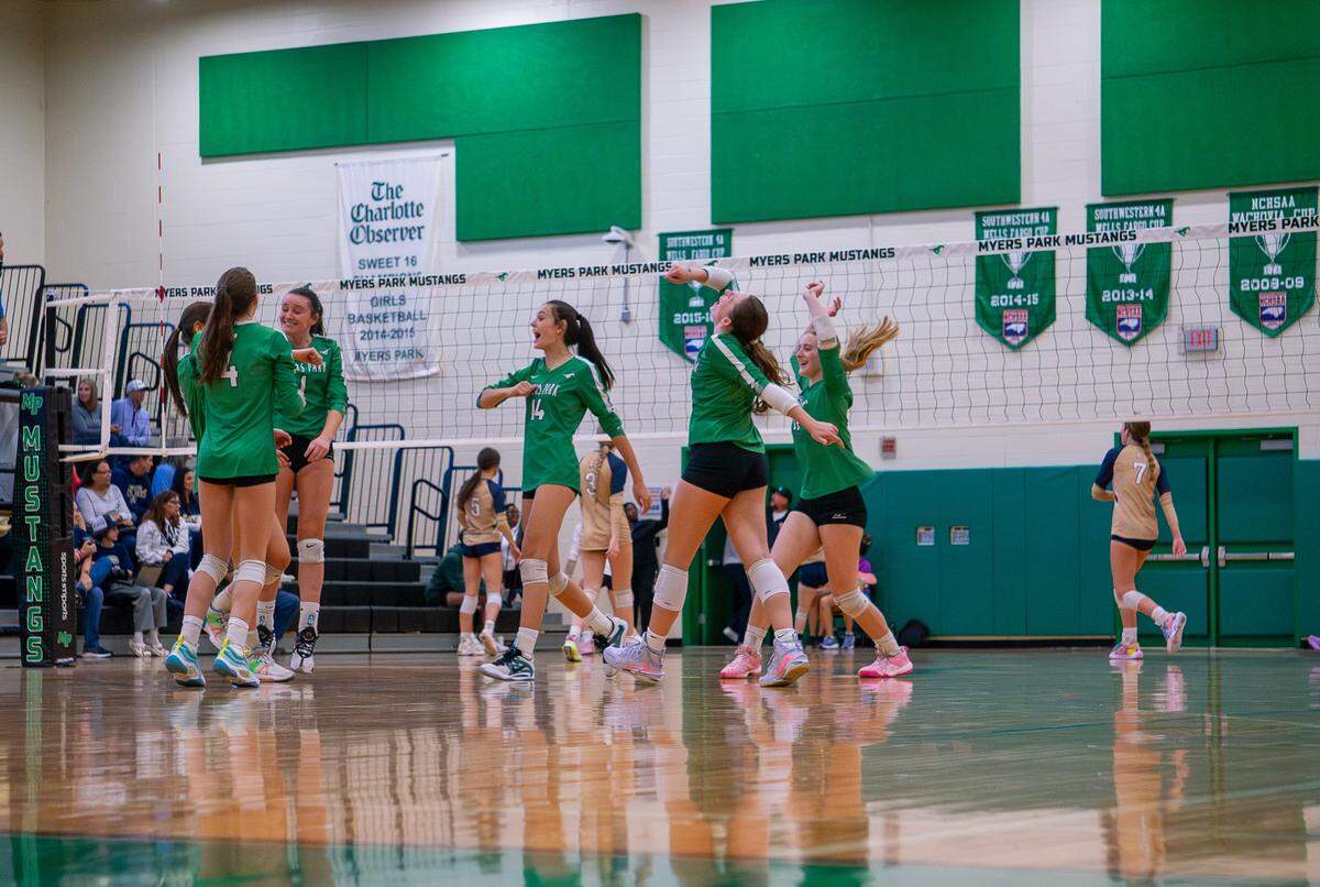 Title: Set Won Myers Park High School Volleyball Team wins final point in set.