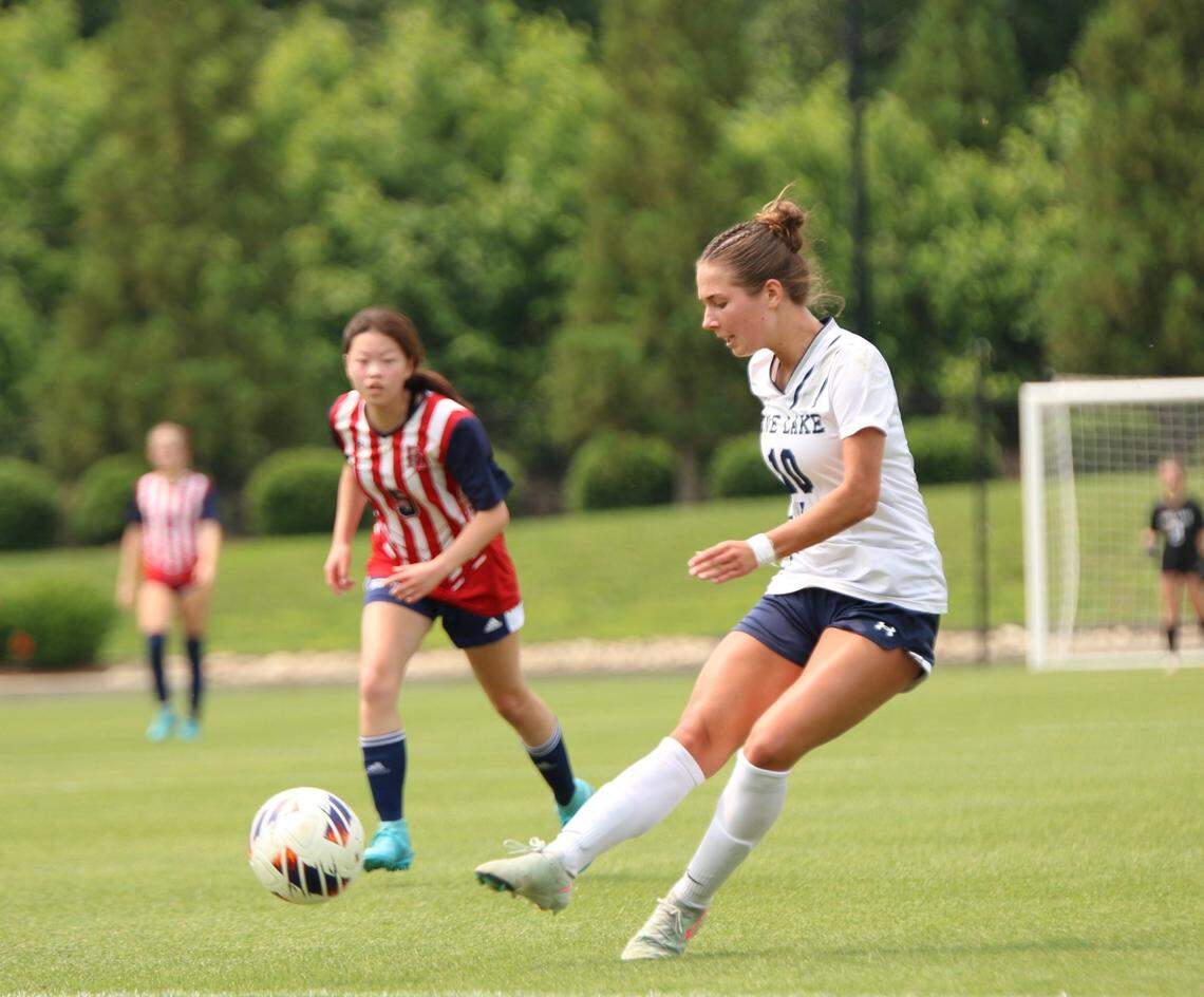 Pine Lake Prep’s Sadie Peterson passes the ball to a teammate during Saturday’s NCHSAA 2A girls’ soccer state championship game in Matthews, NC, on May 31, 2025