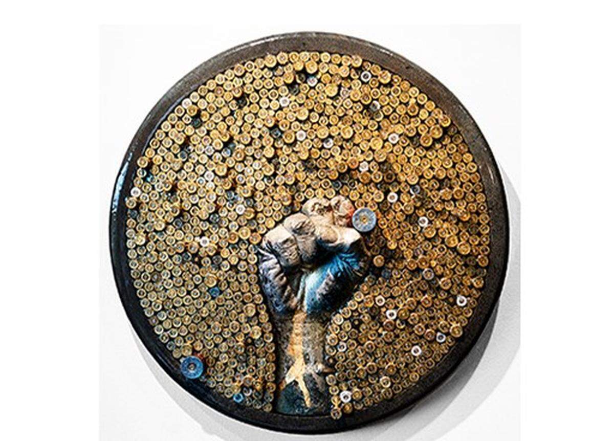 This portion of the 5 lbs. installation by Stephen L. Hayes Jr. that’s included in his “Beyond Any Means” exhibit at Eldery Gallery of Contempoary Art is made of shell casings, hydro-stone, paint, wood and resin.