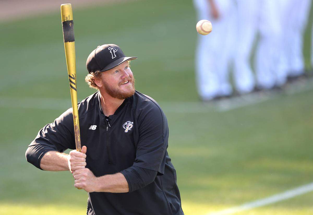 Providence Panthers head coach Danny Hignight smiles as he hits batting practice balls to his team prior to action against West Forsyth in NC 4A quarterfinal action on Friday, May 20, 2022 at Providence High School. The Panthers defeated West Forsyth 4-3.