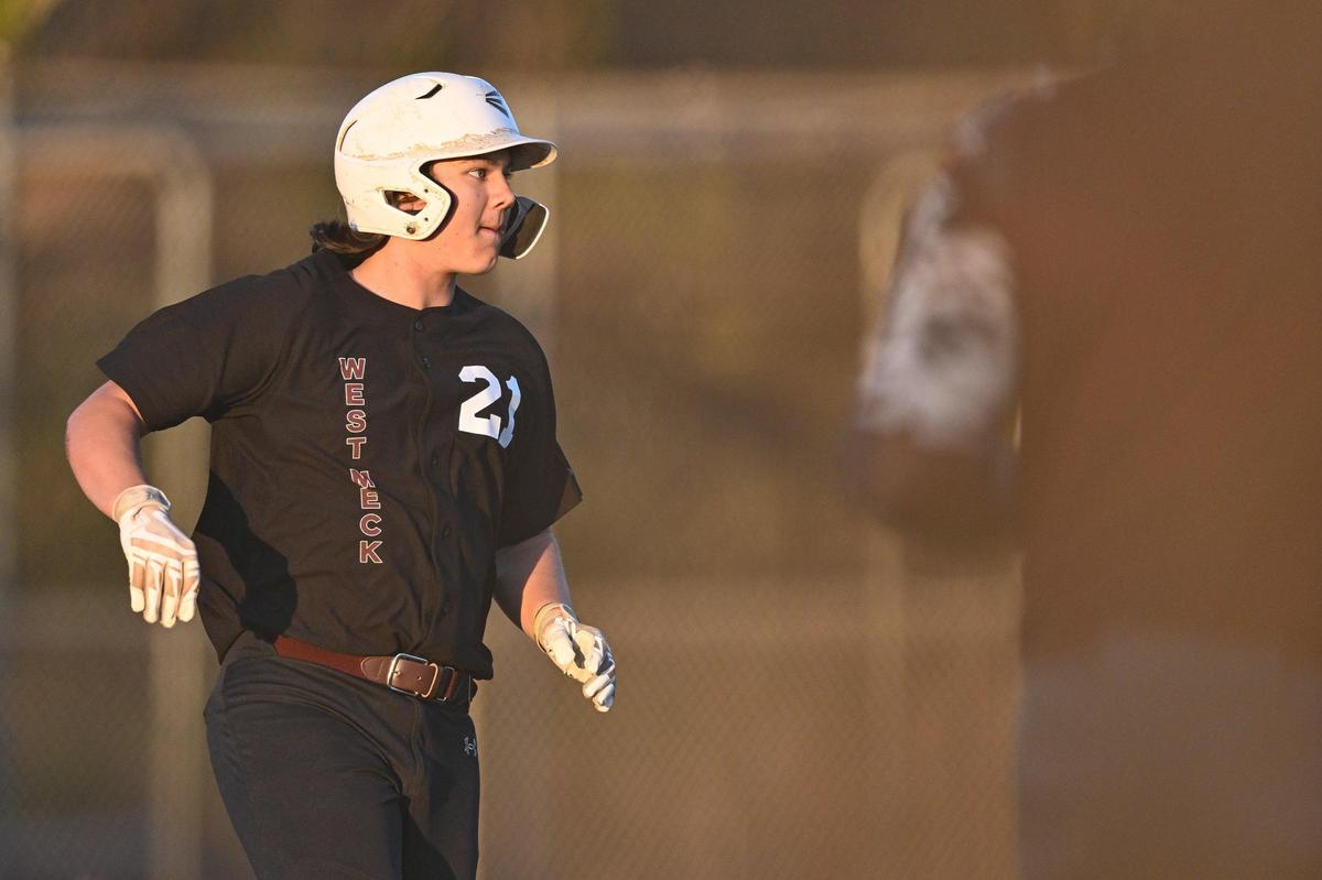 West Mecklenburg’s Caden Clinard (21) rounds first base during a varsity baseball game against West Charlotte, Tuesday, March 18, 2022, in Charlotte, N.C. (Charlotte Observer/Matt Kelley)