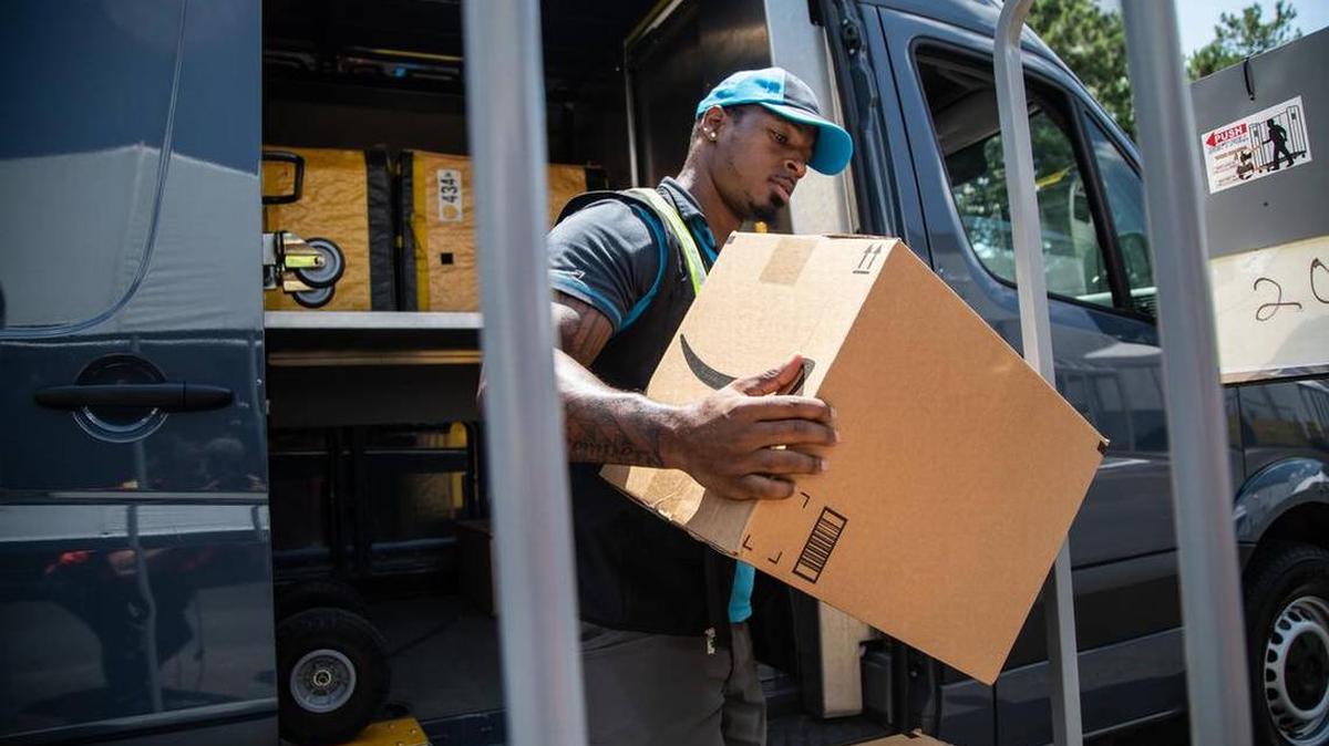 An Amazon employee loads packages in Durham last year. In the wake of protests over George Floyd’s death corporations like Amazon, Target, Walmart and others have issued press releases or turned to social media to voice concerns about racial injustice.