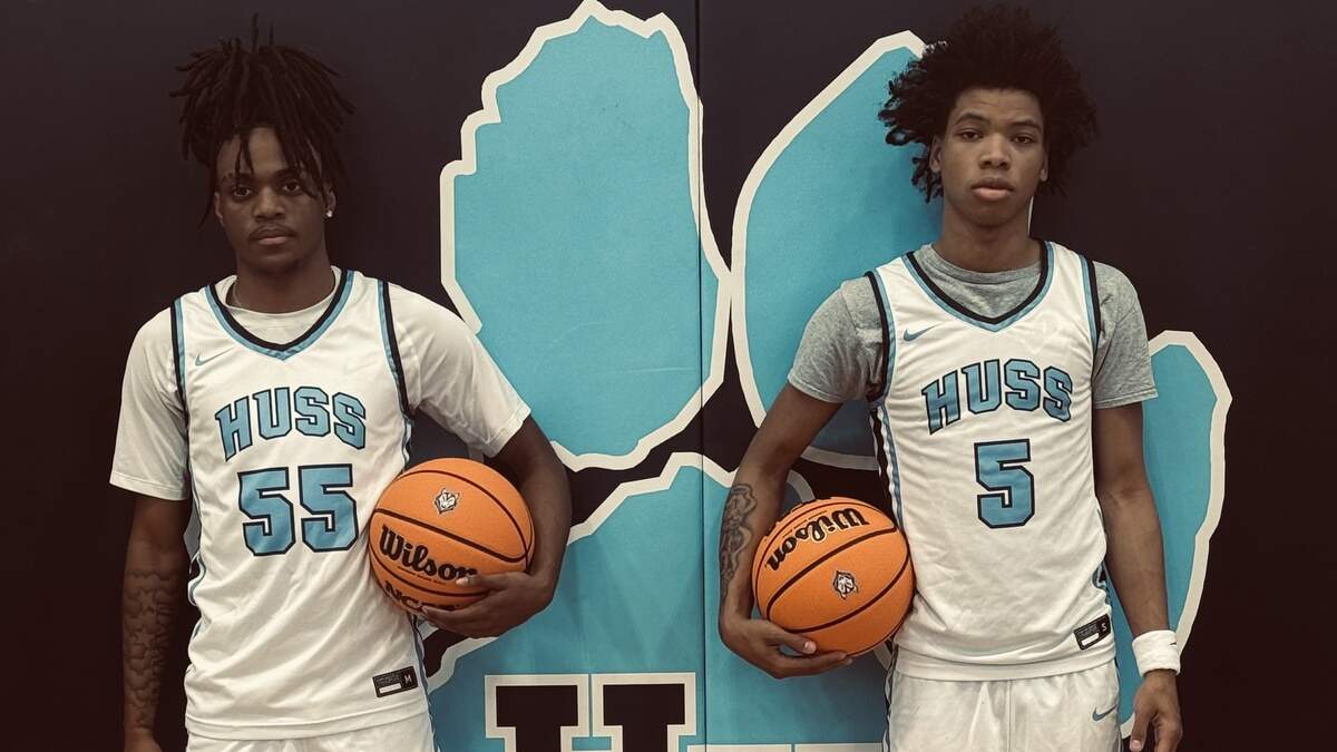Hunter Huss guards Zaiyir Phillips (left) and Jaleel Smith.