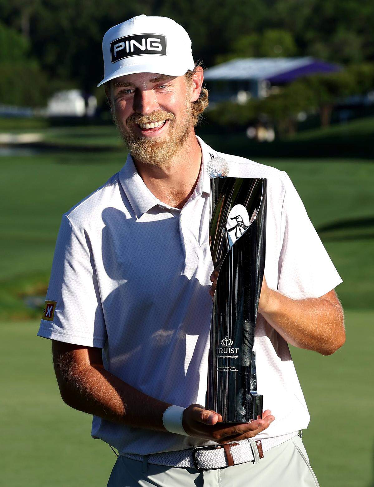 Golfer Kristoffer Reitan poses with the Truist Championship trophy at Quail Hollow Club in Charlotte, NC on Sunday, May 10, 2026. Reitan won the Truist Championship finishing at -15.