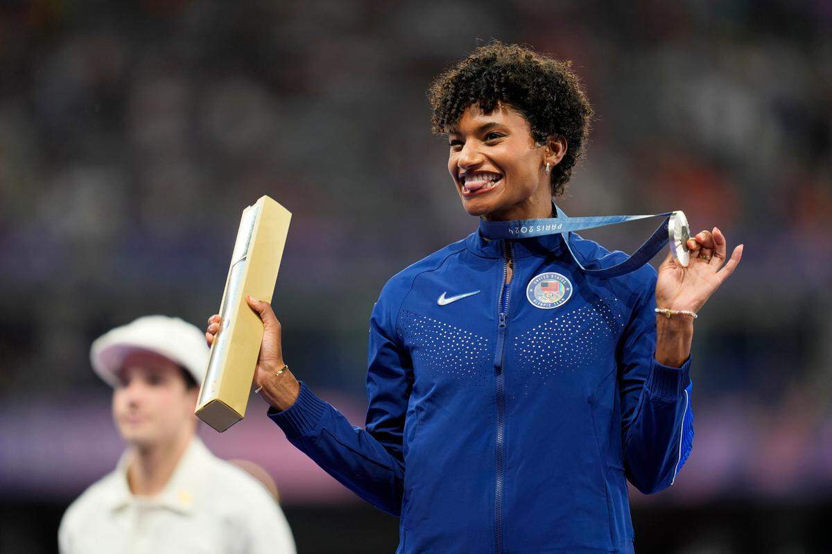Aug 9, 2024; Paris Saint-Denis, France; Anna Cockrell (USA) celebrates her silver medal in the womens 400m hurdles during the Paris 2024 Olympic Summer Games at Stade de France. Mandatory Credit: Andrew Nelles-USA TODAY Sports