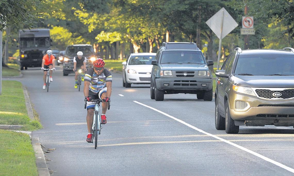 Cyclists ride The Booty Loop course along Queens Road on Wednesday.