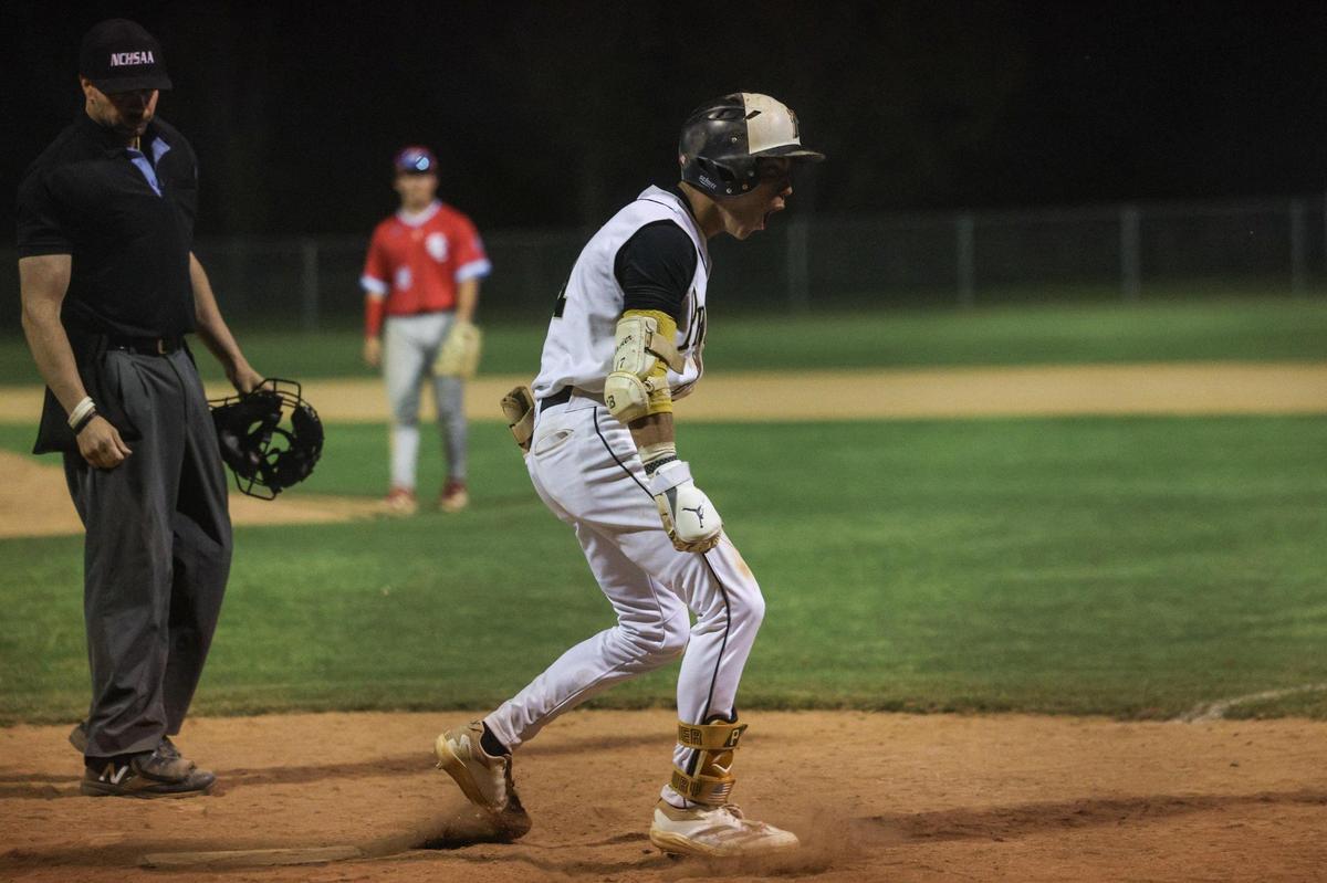 Providence’s Xavier McCoury celebrates at home plate after hitting a home run in the bottom of the eigth inning, giving them a 5-4 victory over Charlotte Catholic in the Southwestern 4A championship baseball game at Garinger High School in Charlotte, NC on Thursday, May 1, 2025.
