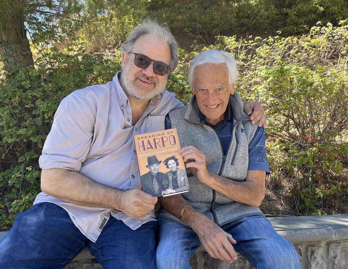 Marx Brothers historian Robert S. Bader, left, and Bill Marx, son of Harpo Marx, holding a copy of his mother Susan’s book. Bader had collaborated on that book. Bill Marx was thrilled to team up with Bader on the “Harpo Speaks!” album project.