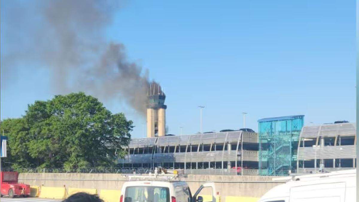 Smoke comes from the old control tower at the Charlotte Douglas International Airport Thursday morning.