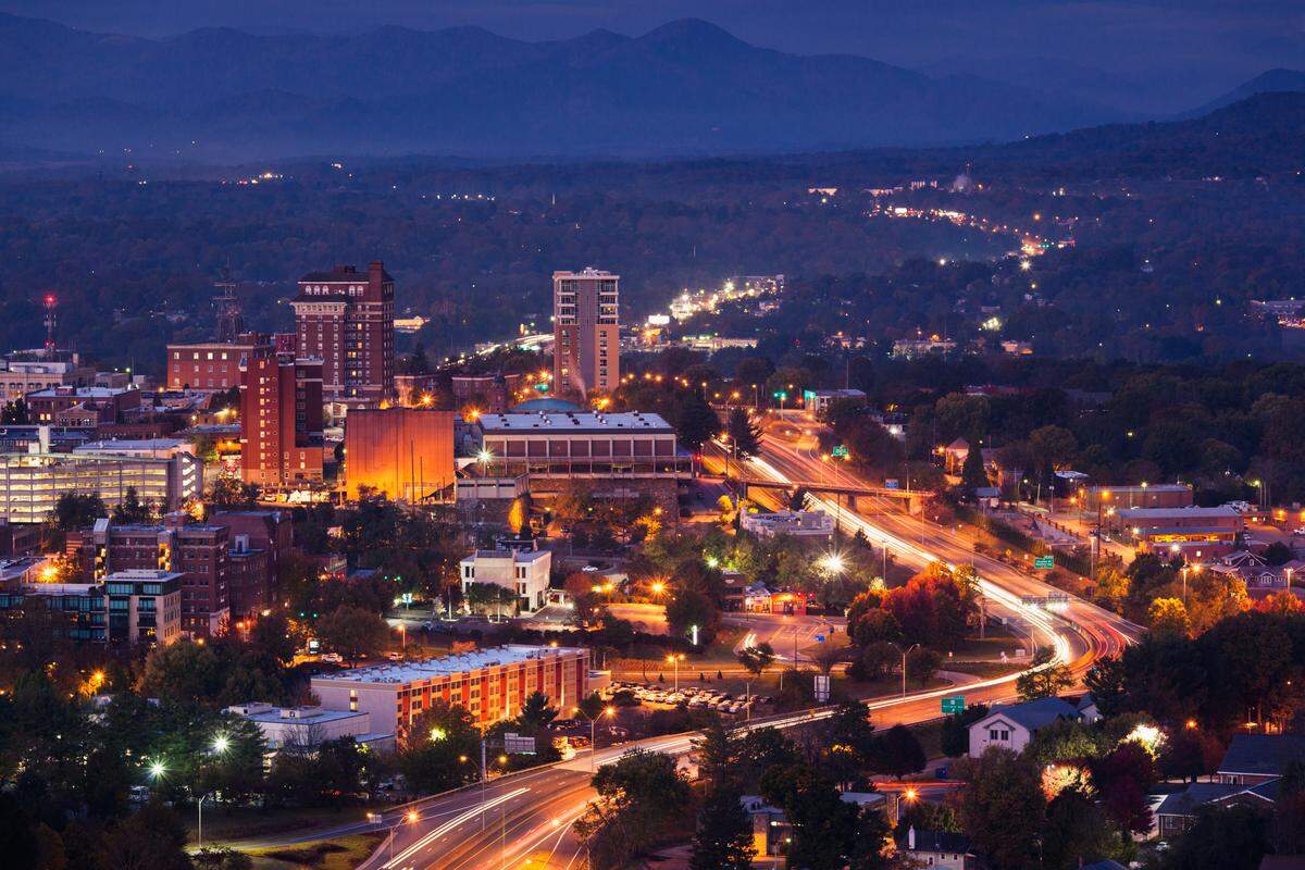 The Asheville, NC city skyline at dawn.
