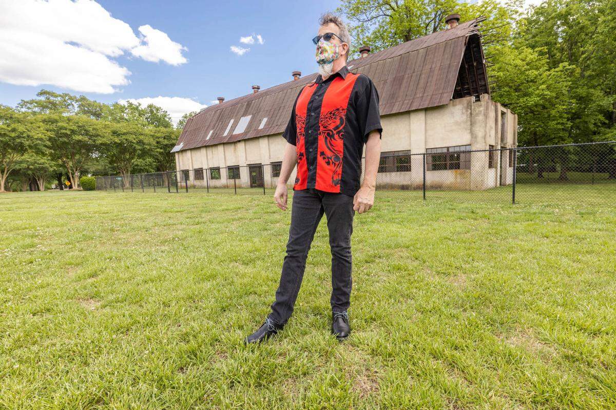 Actor’s Theatre of Charlotte executive director Chip Decker shows off the Rock The Barn site for the summer and fall’s rock musical series. 