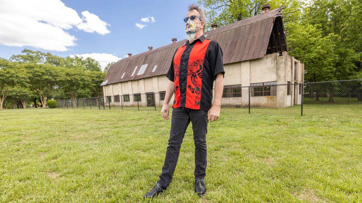Actor’s Theatre of Charlotte executive director Chip Decker shows off the Rock The Barn site for its outoor musical series.