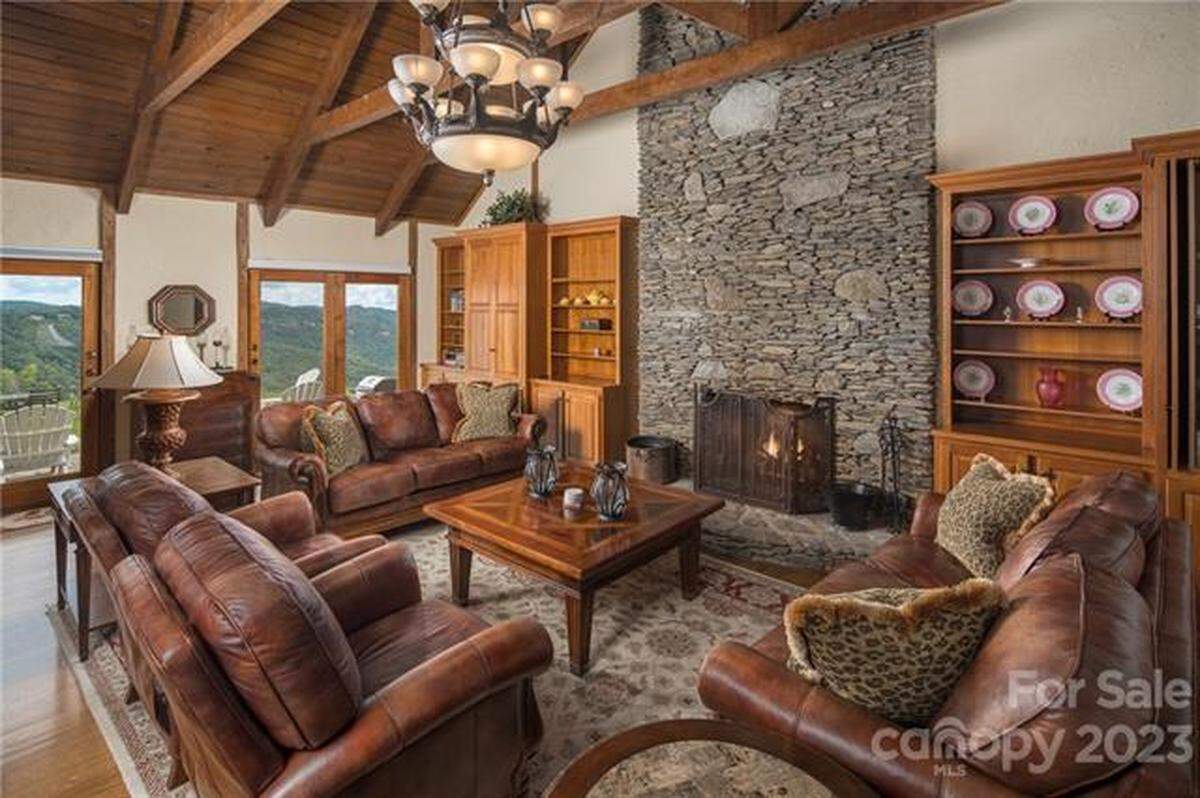 The property includes three primary residences with views of Johns River Gorge, stretching to the Charlotte skyline, and Grandfather Mountain.
