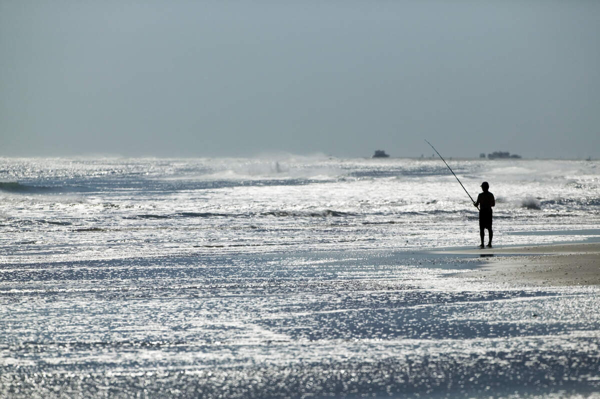 Spend the day surf fishing at Ocracoke Island, North Carolina.