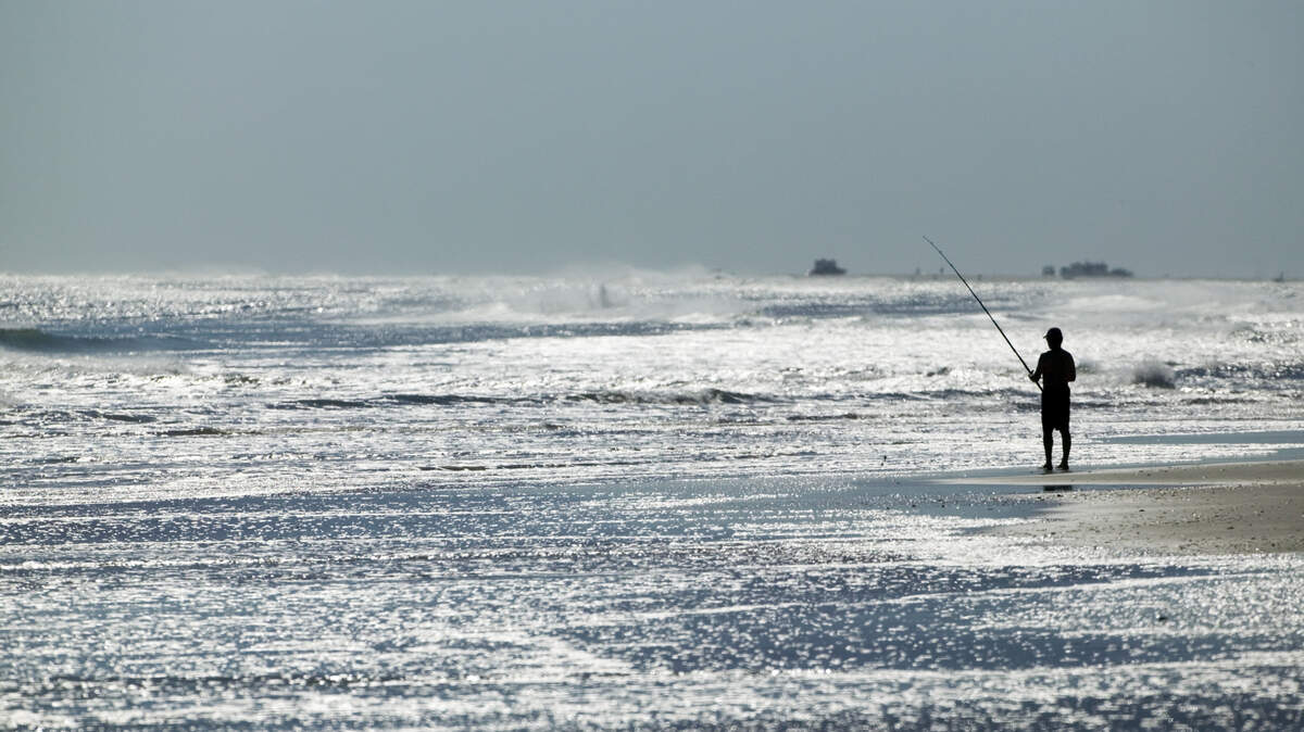 Spend the day surf fishing at Ocracoke Island, North Carolina.
