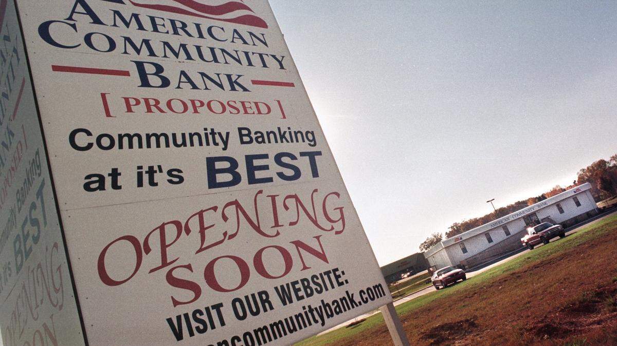 A sign announces the coming headquarters of Monroe-based American Community Bank, which opened in 1998 and merged in 2009 with Yadkin Bank. A group planning to open a new bank in Monroe, American Bank & Trust, has said it will add to the list of banks in the region that have had “American” in their name. On Wednesday, the N.C. Office of the Commissioner of Banks granted charter approval for American Bank & Trust.