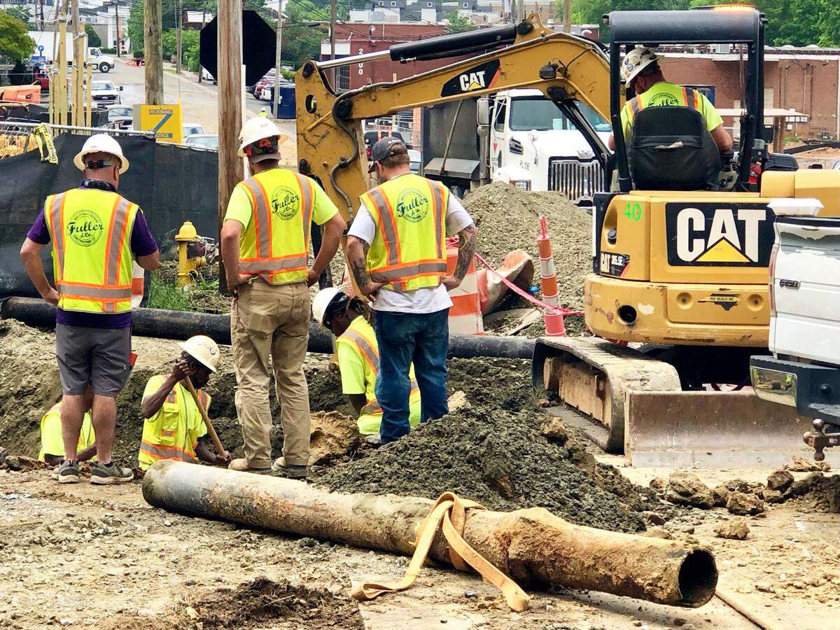 Workers resume working at the intersection of Distribution and Dunavant streets in South End on Thursday, May 5, 2022. Repairs to a damaged water main could take several hours, according to the city utility.