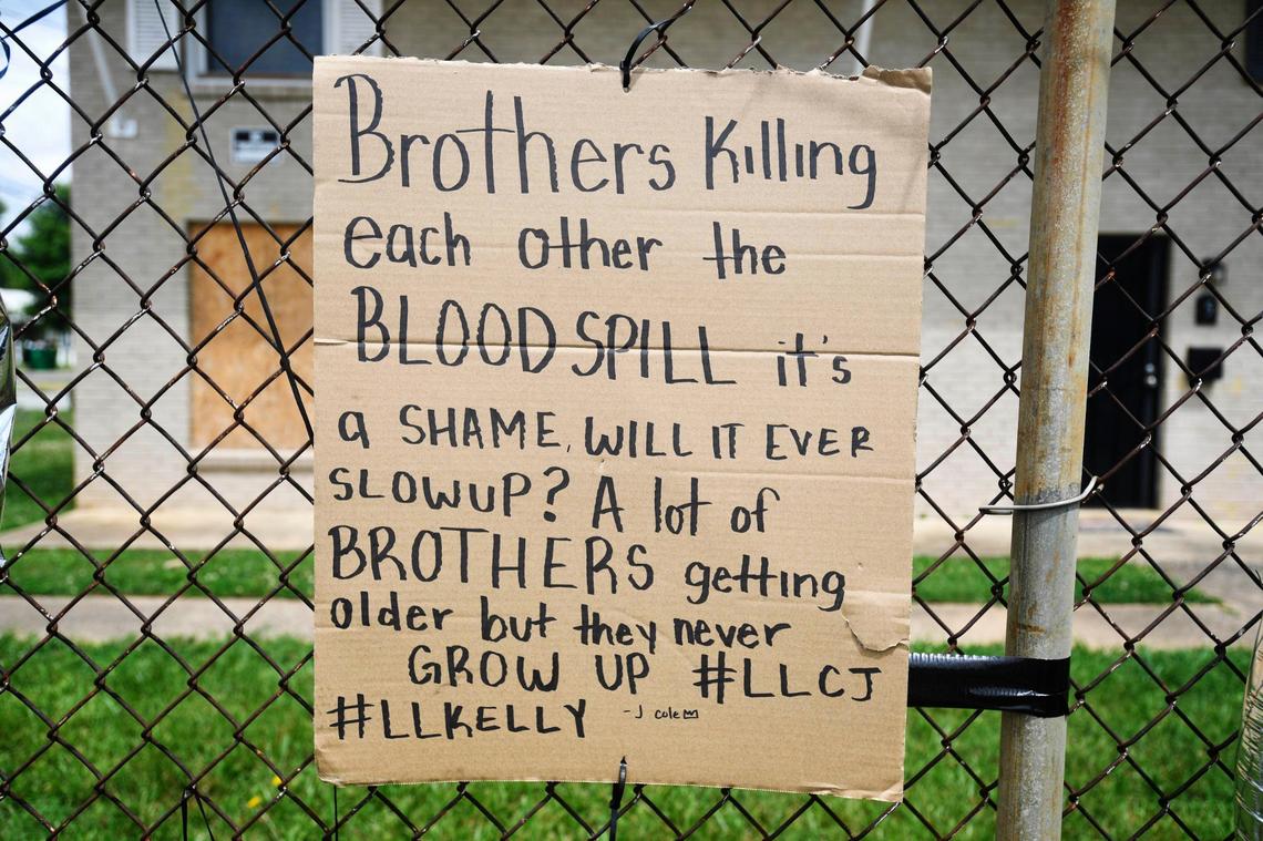 A sign is attached to a fence at the Queens Mini Mart as a memorial set up for Christopher Antonio Gleaton, near the corner of Beatties Ford Road and Catherine Simmons Avenue on Tuesday, June 23, 2020. Gleaton was one of three people killed at an outdoor party on Sunday night.