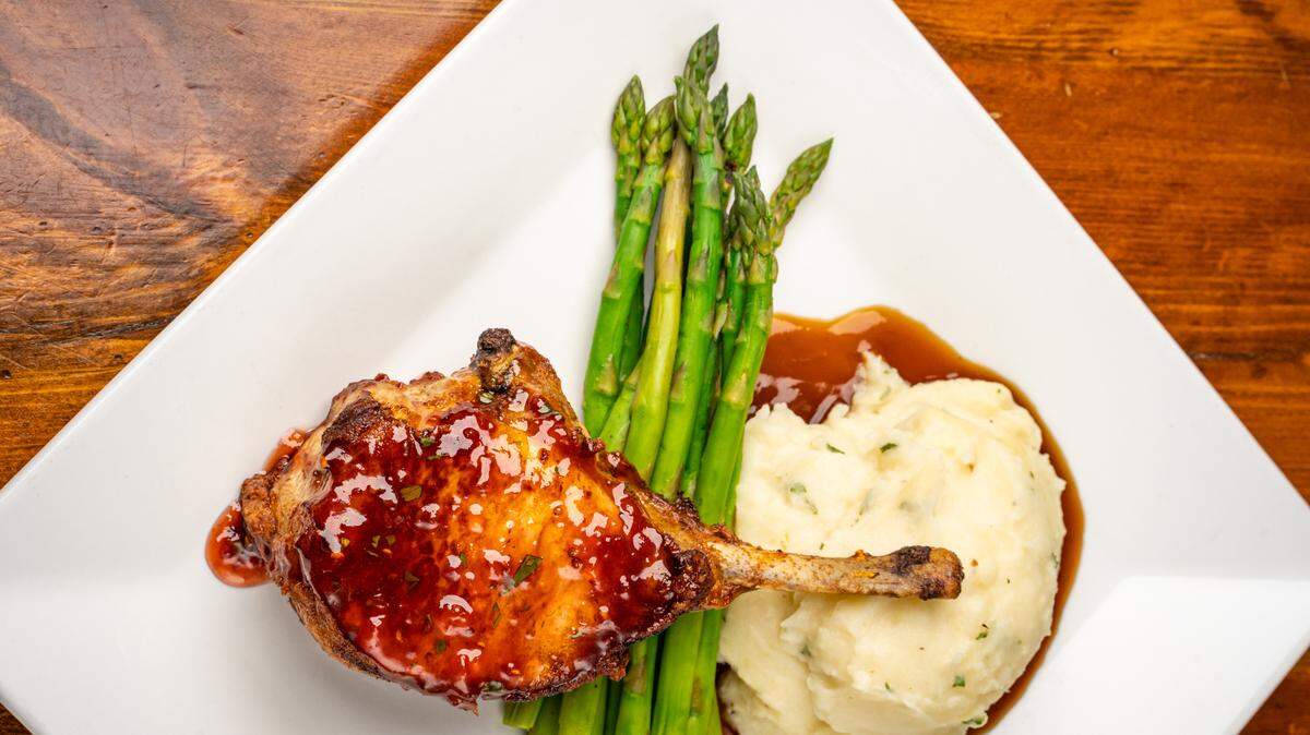 The Bone-in Berkshire Pork Chop at Harry’s Grille & Tavern.