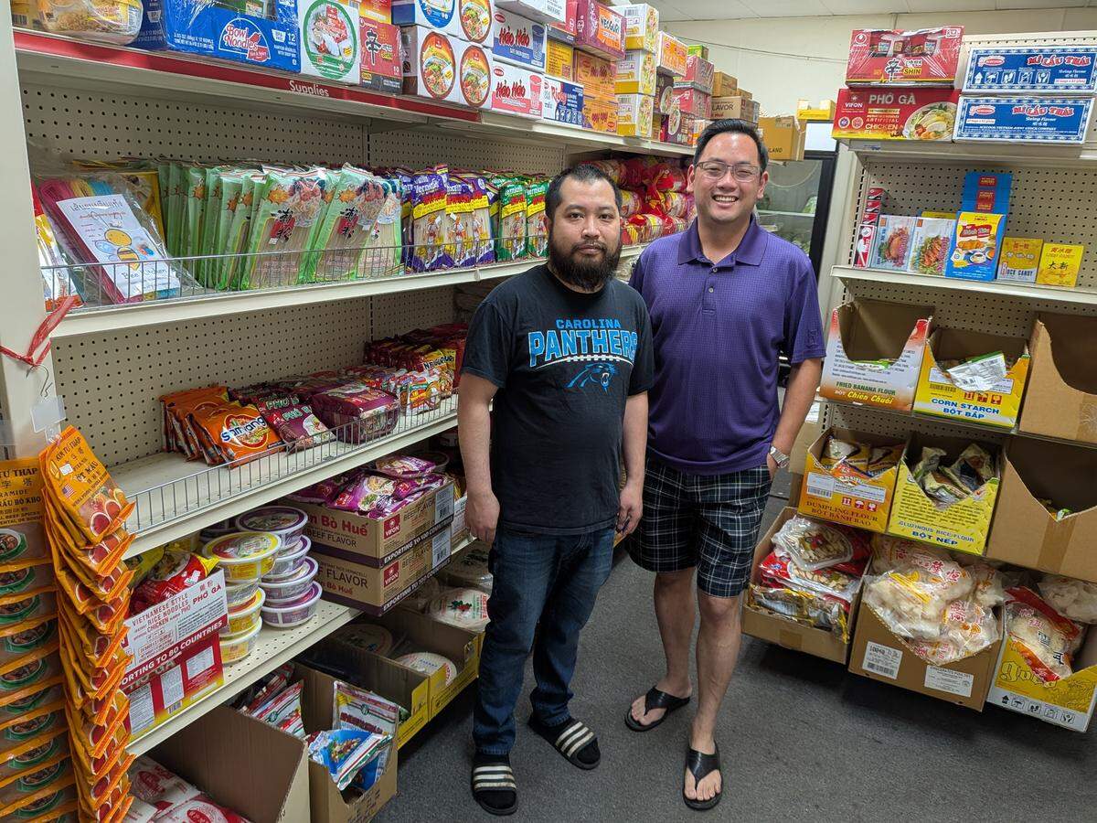 Golden Elephant Asian Market owner Bo Sayaphet and friend Eddie Chang, owner of Asian Market Albemarle, talk about how tariffs are affecting their businesses.