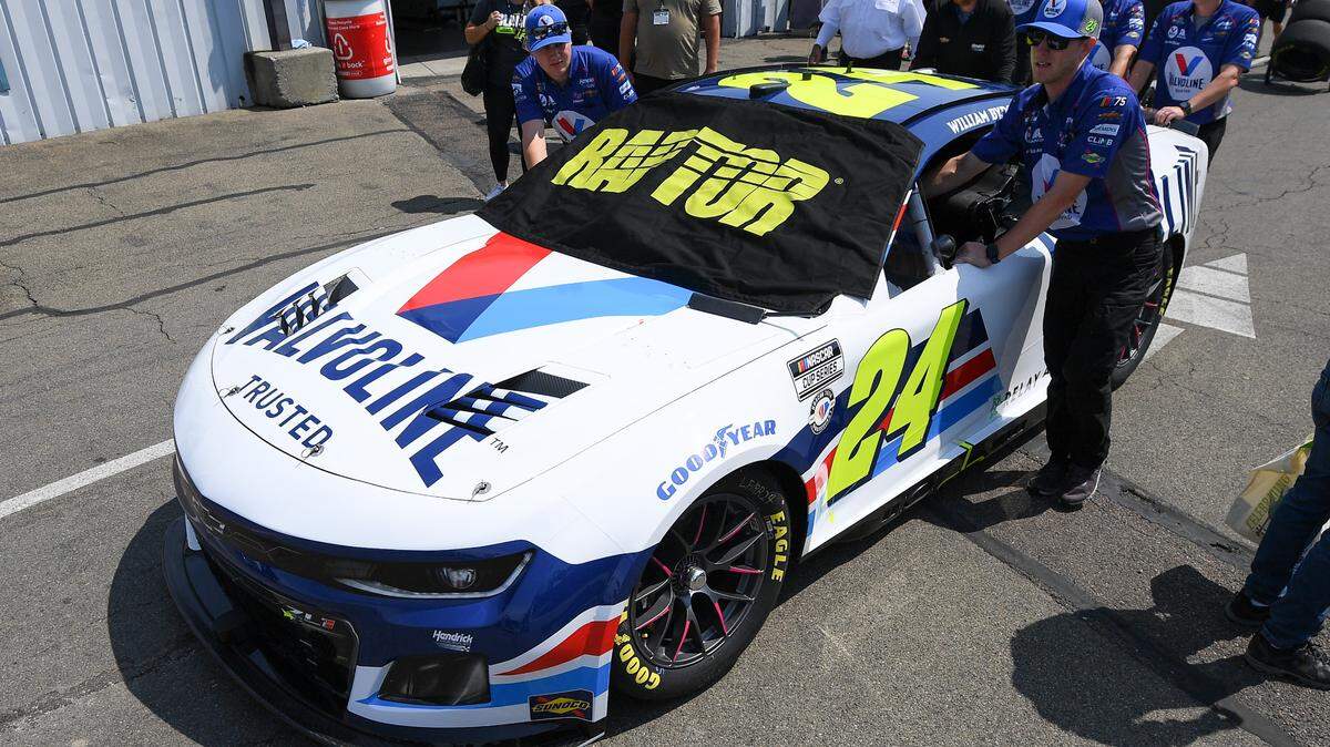 Crew members push the car of NASCAR Cup Series driver William Byron (not pictured) to the grid prior to the Go Bowling at The Glen at Watkins Glen International.