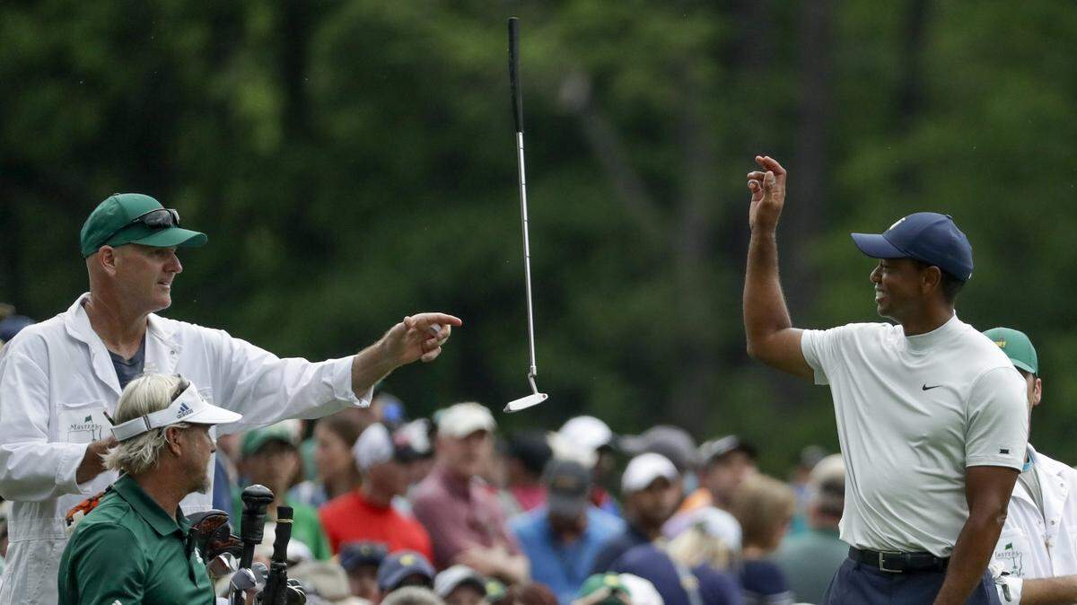 A balky putter cost Tiger Woods valuable ground Friday in the second round of the Masters. But a late surge left him a shot off the lead. (AP Photo/Chris Carlson)