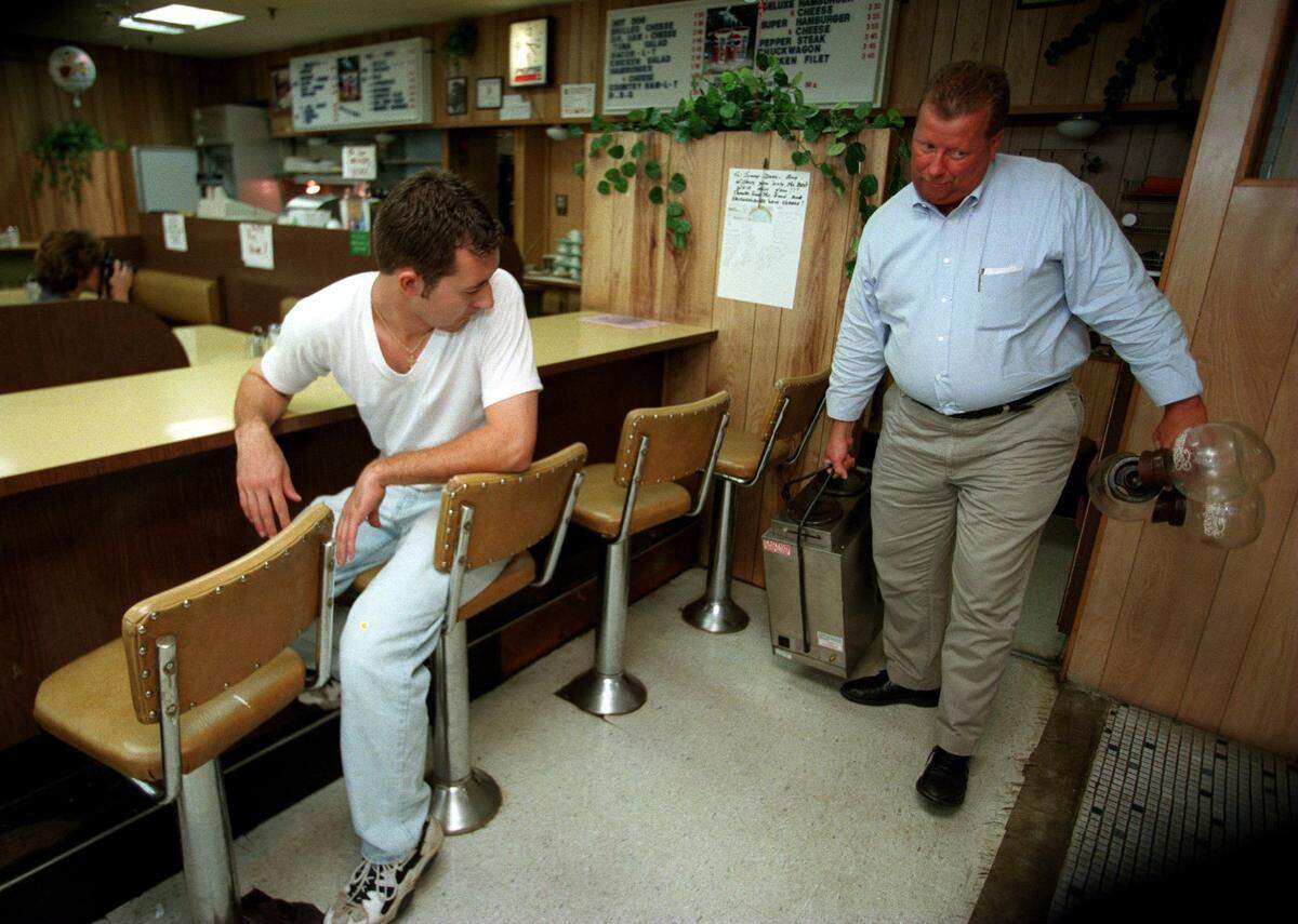“This type of concept is a dying breed ... coffee shops”, said Donald Thrift, right, of the Standard Coffee Service as he removed a coffee maker and empty pots from the Stanley Drug Store lunch counter on the last day of food service on Aug. 20, 1997.