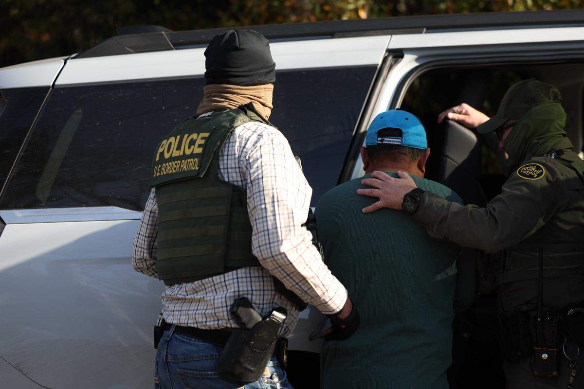 Border Patrol agents seen arresting a man in southeast Charlotte on Sharonbrook Drive who was walking back to his home  Sunday morning, Nov. 16, 2025.