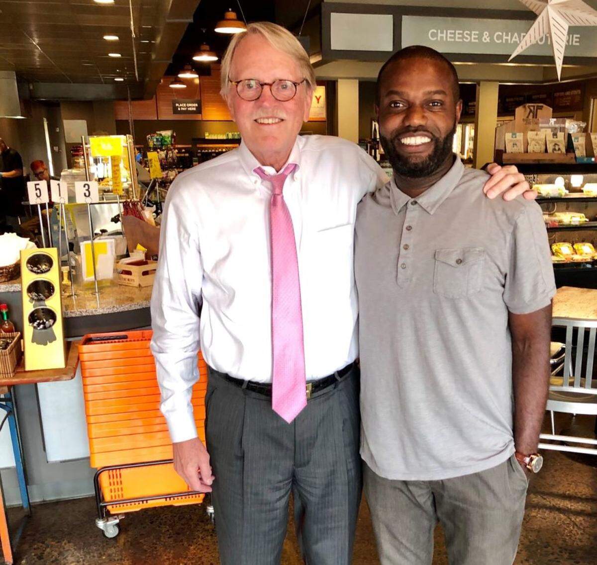 Mike Hawley, left, and Armah Shiancoe met at a Central Piedmont Community College reception.