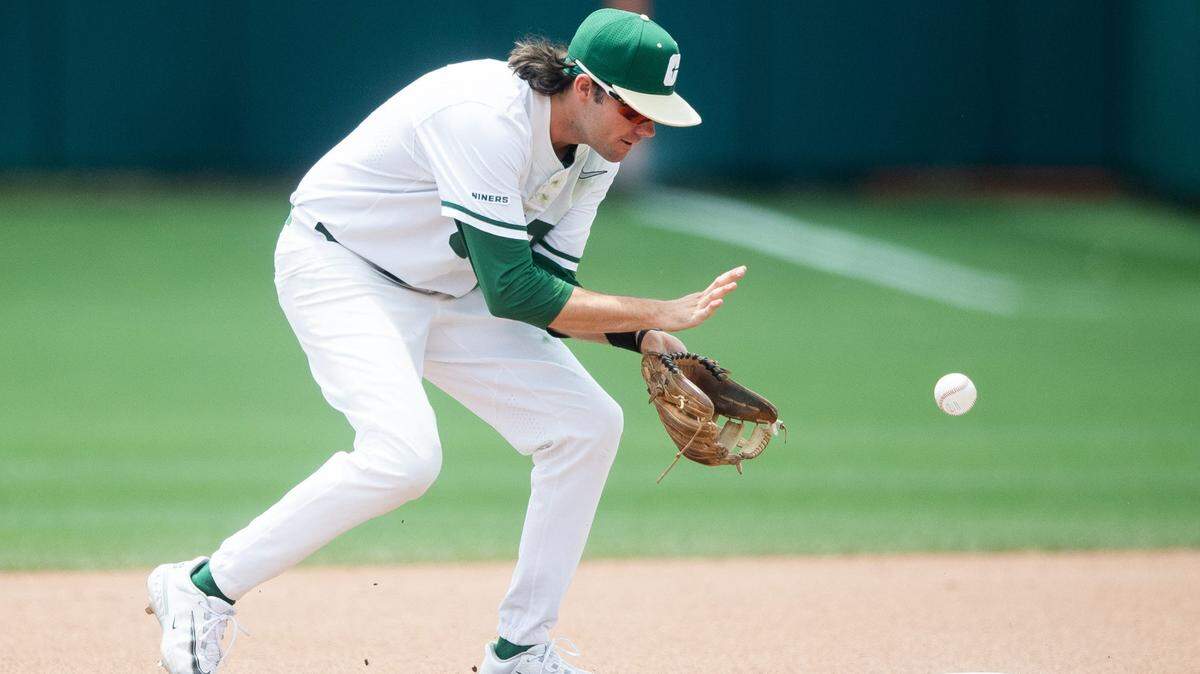 Charlotte’s Austin Knight (14) fields the ball during Sunday’s NCAA baseball tournament action in Clemson, S.C.