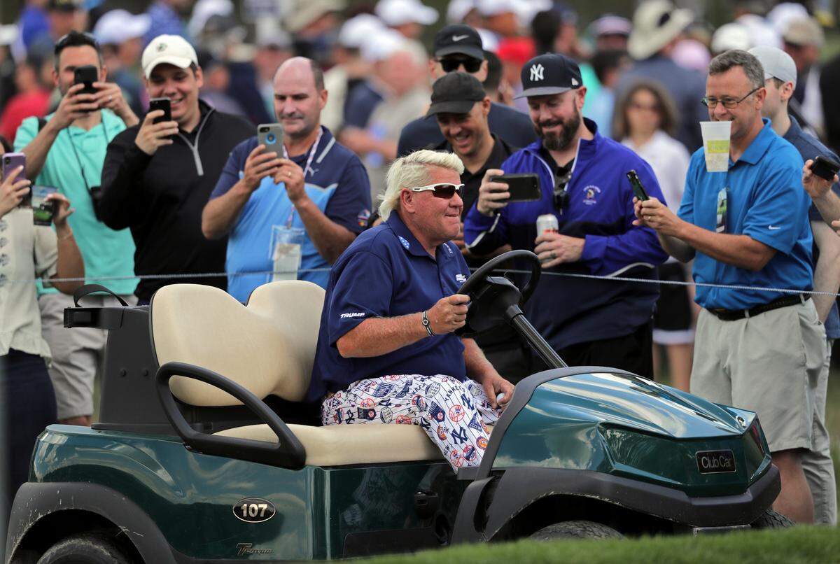John Daly drives to the 10th tee in a golf cart during the first round of the PGA Championship golf tournament, Thursday, May 16, 2019, at Bethpage Black in Farmingdale, N.Y. (AP Photo/Charles Krupa)