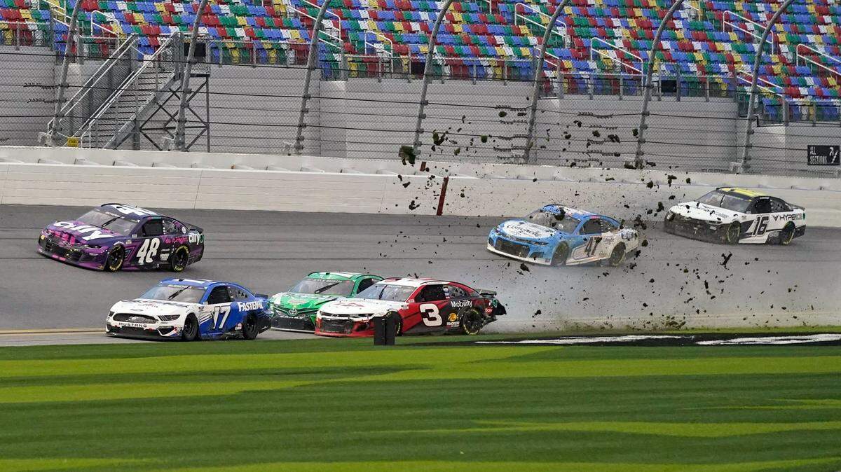 Austin Dillon (3) and Kyle Busch, center left, crash heading down the front stretch as Chris Buescher (17), Alex Bowman (48), Ricky Stenhouse Jr. (47) and AJ Allmendinger (16) make moves to avoid the crash during NASCAR Cup Series road course auto race at Daytona International Speedway, Sunday, Feb. 21, 2021, in Daytona Beach, Fla. (AP Photo/John Raoux)