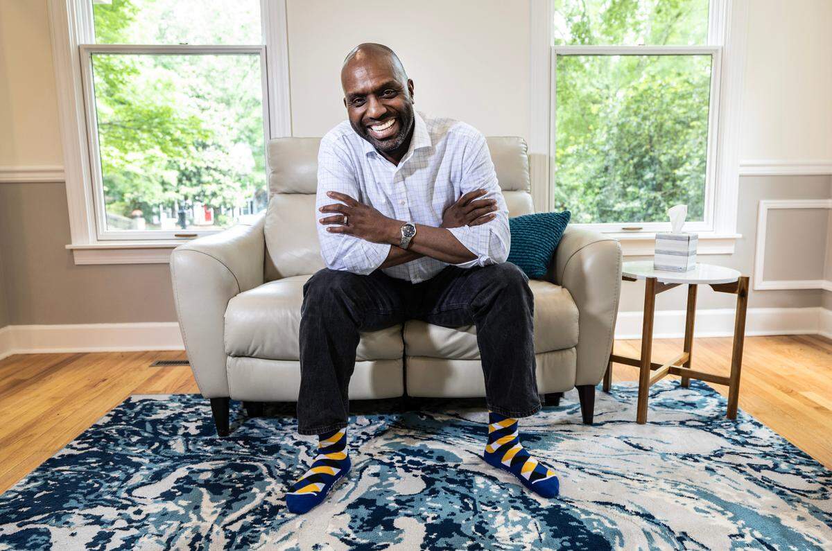 Albert Blake poses in his home in Chapel Hill, N.C., Wednesday, May 8, 2024. In 1983 Blake was in the first group of students who received a college scholarship called the Greater Step Scholars, a unique fund for children who grew up in public housing. The fund continues today, helping 1000 teens since its founding.