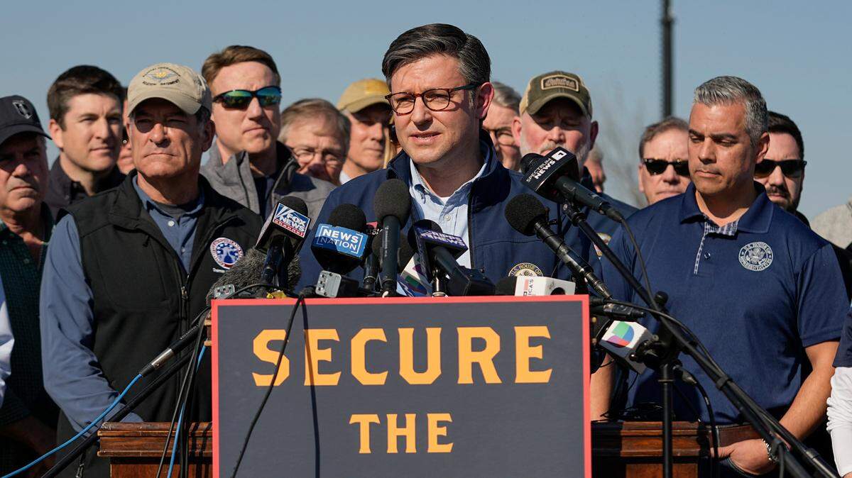 U.S. House Speaker Mike Johnson speaks while standing with Republican members of Congress on Jan. 3, 2024 in Eagle Pass, Texas. On Jan. 31, during his first floor speech as Speaker, Johnson railed against the Senate’s bipartisan immigration deal.