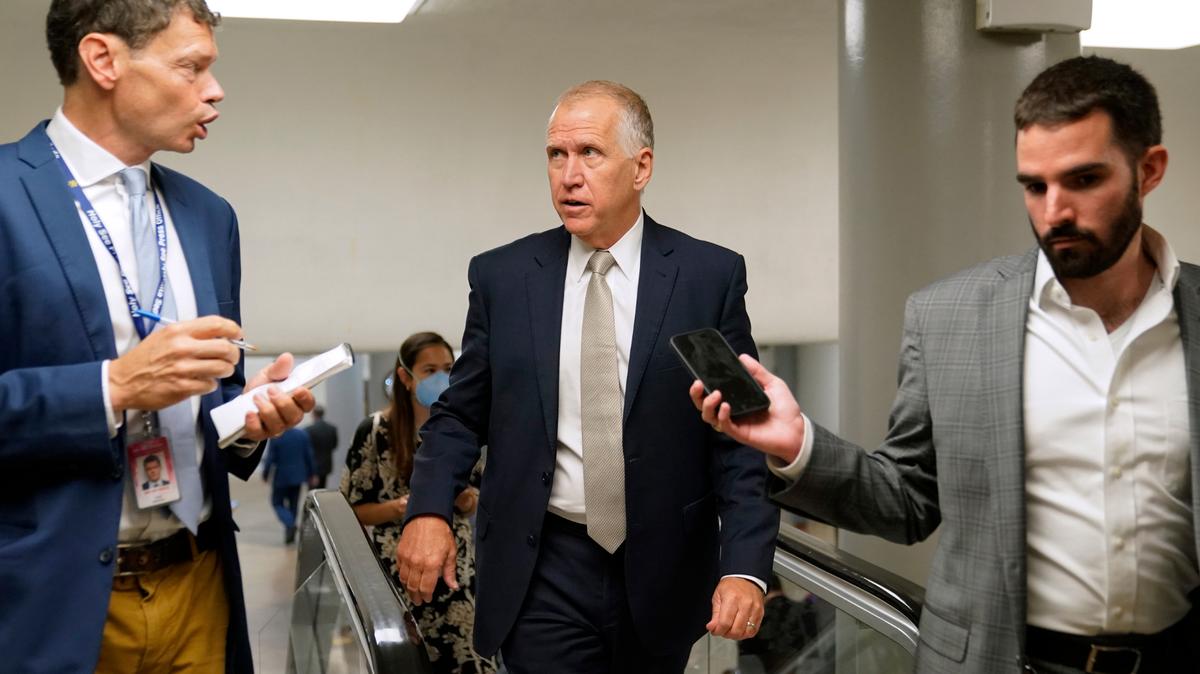 Sen. Thom Tillis, R-N.C., center, speaks with reporters on Capitol Hill in Washington on June 9, 2022. Tillis was among a group of four Republican and Democratic senators who hammered out a bipartisan agreement on gun reform after two weeks of closed-door talks.