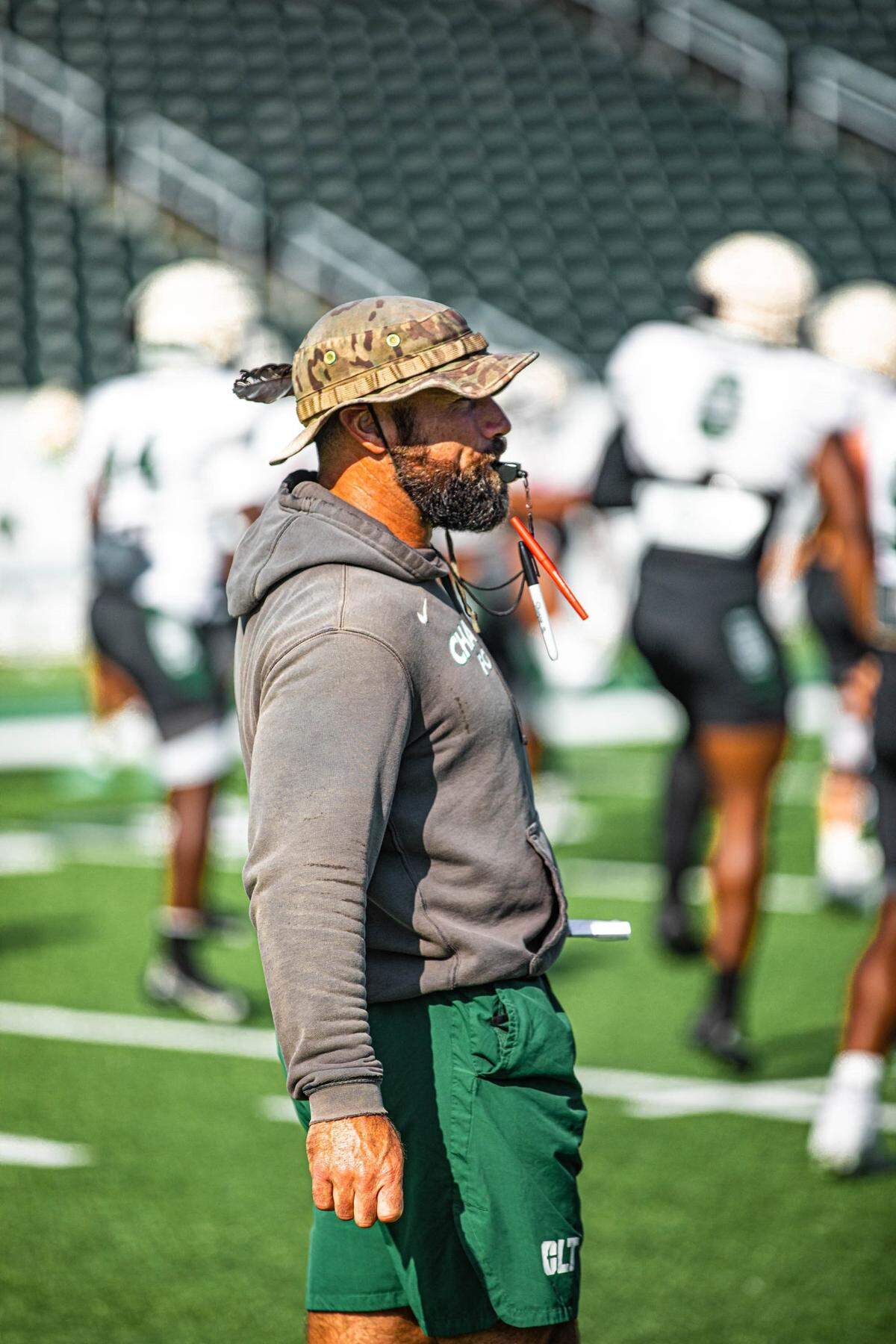 Charlotte 49ers director of football performance Chris Laskowski observes practice during preseason. Laskowski and the 49ers open their season Saturday, Aug, 27, at Florida Atlantic, Laskowski’s alma mater.